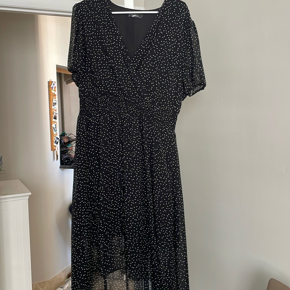Fashion black dress with white dots with elastic waistband and button detail